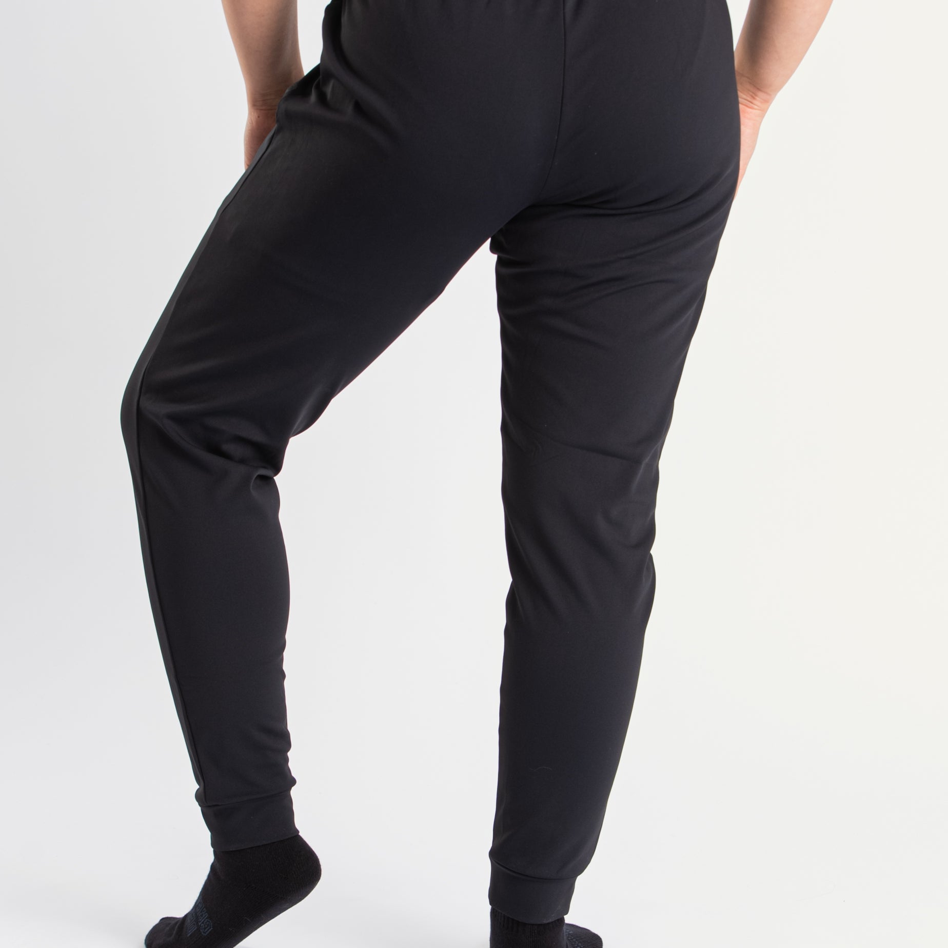 Back view of a7-us.mombra 360Go 1Z Joggers in Stealth, highlighting the elastic waistband and ankle cuffs