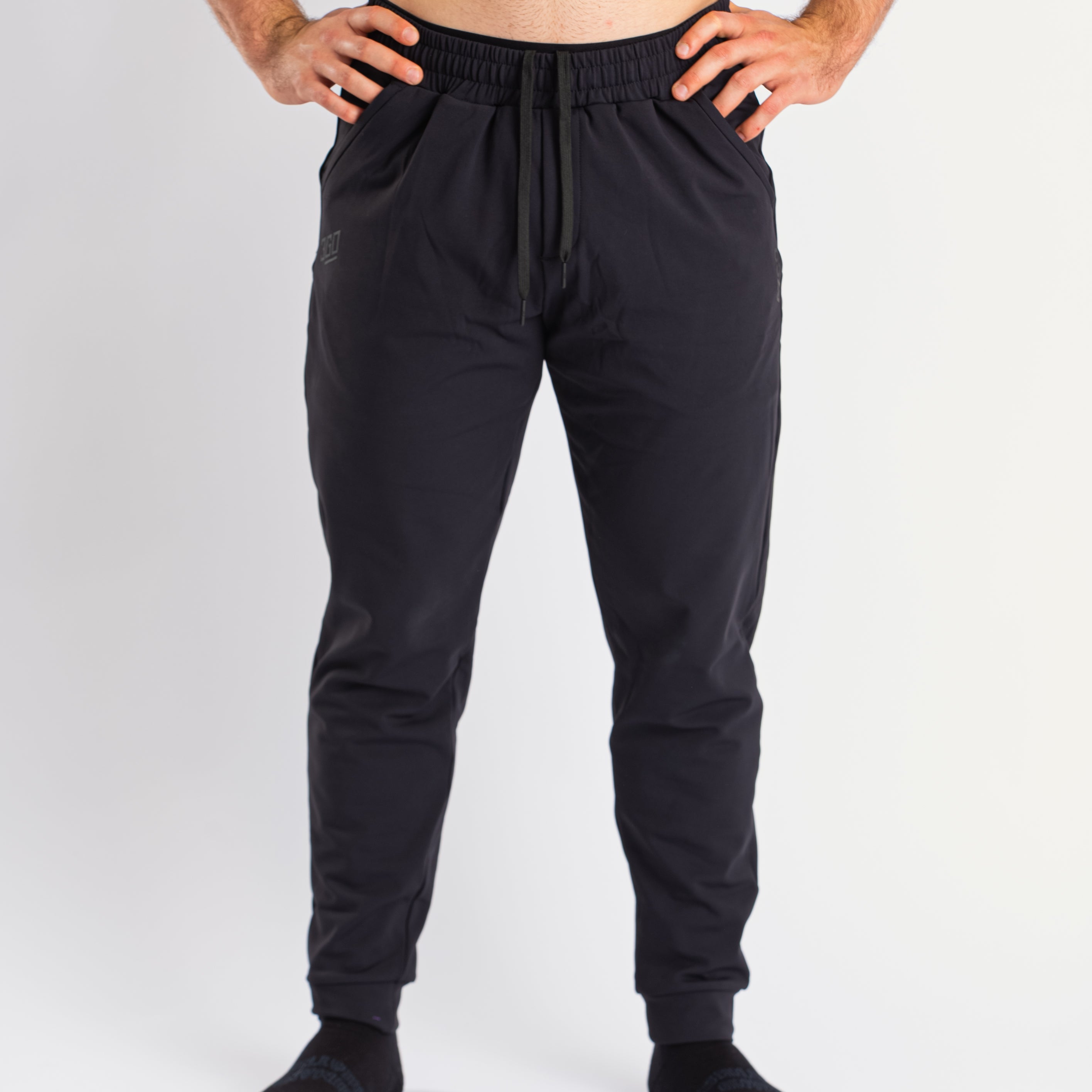 Front view of a7-us.mombra 360Go 1Z Joggers in Stealth, showcasing the sleek design and tapered leg fit.