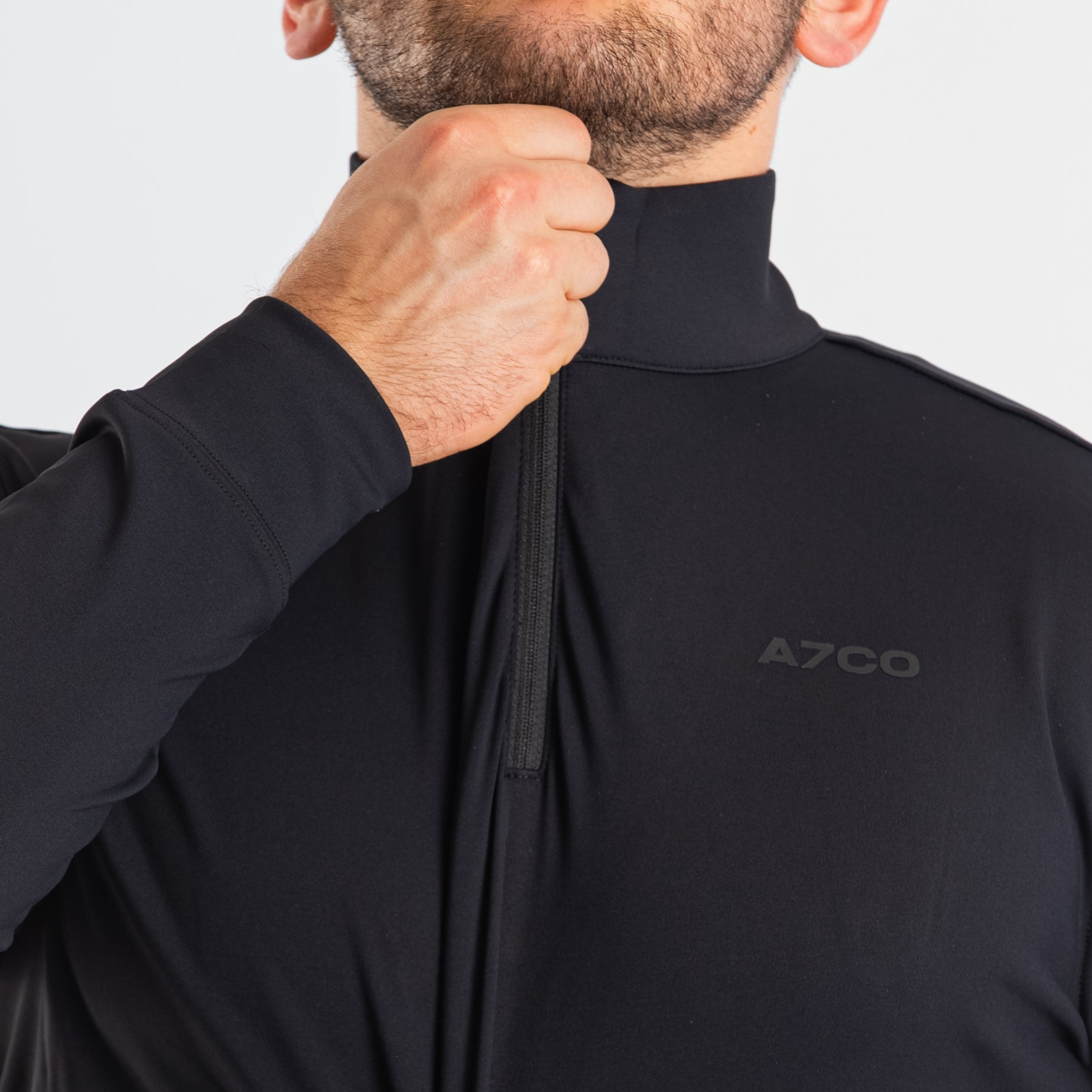 Close-up of the YKK quarter zipper on the a7-us.mombra Quarter Zip Jacket – Stealth, highlighting durable construction and clean collar finish.
