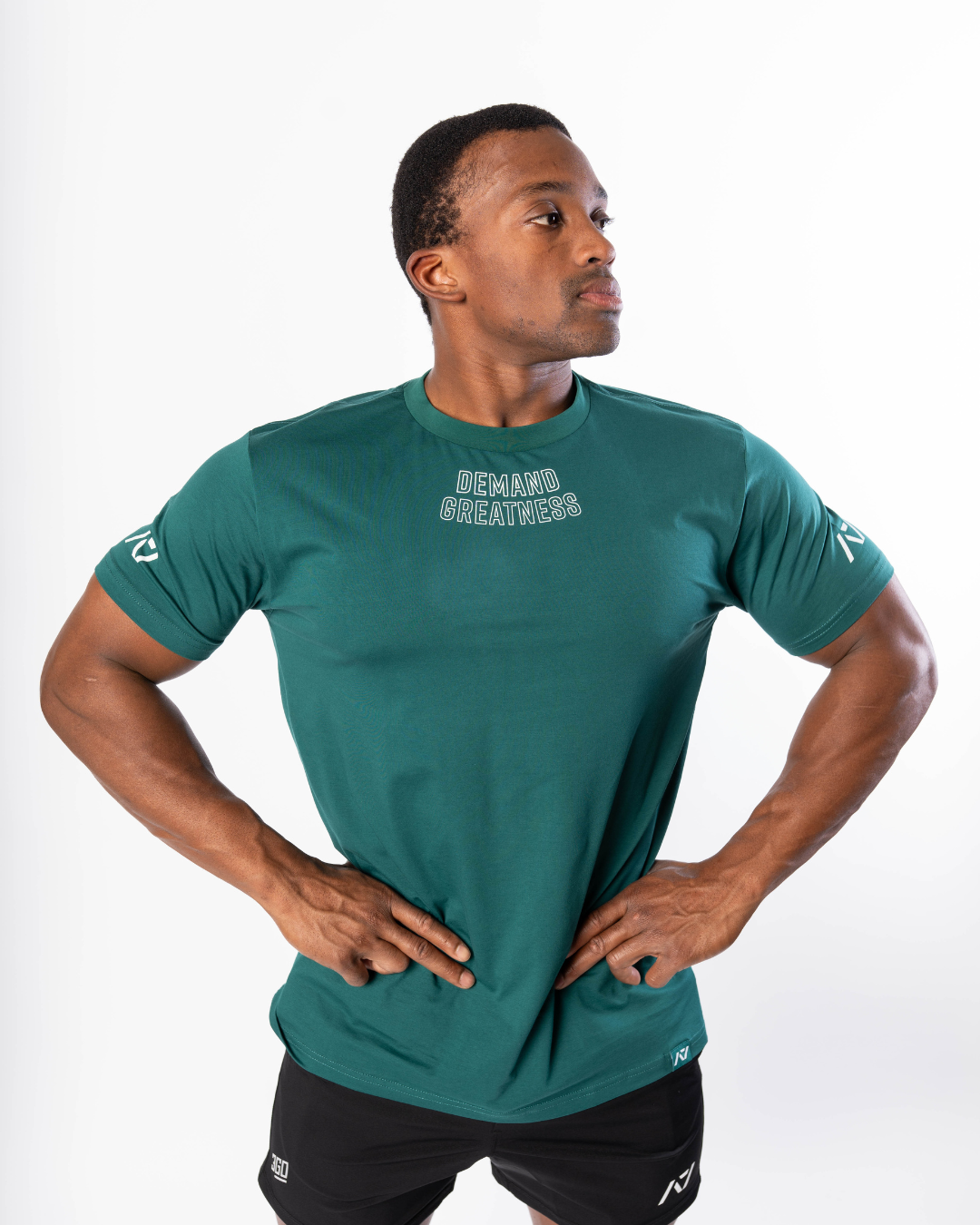 Front view of the Emerald Forás True‑Fit Meet Shirt showing “Demand Greatness” chest print and trimmed fit.