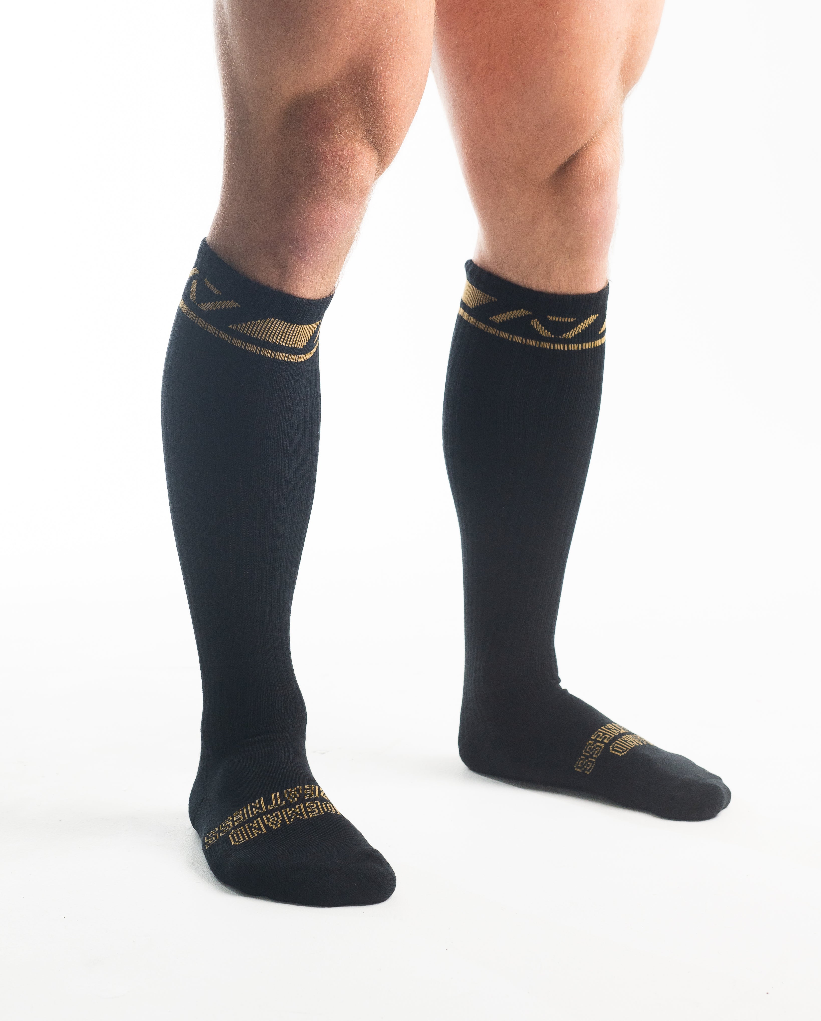 Side profile of A7 Deadlift Socks in Gold Standard, highlighting the A7 logo on the ankle and compression-style top.