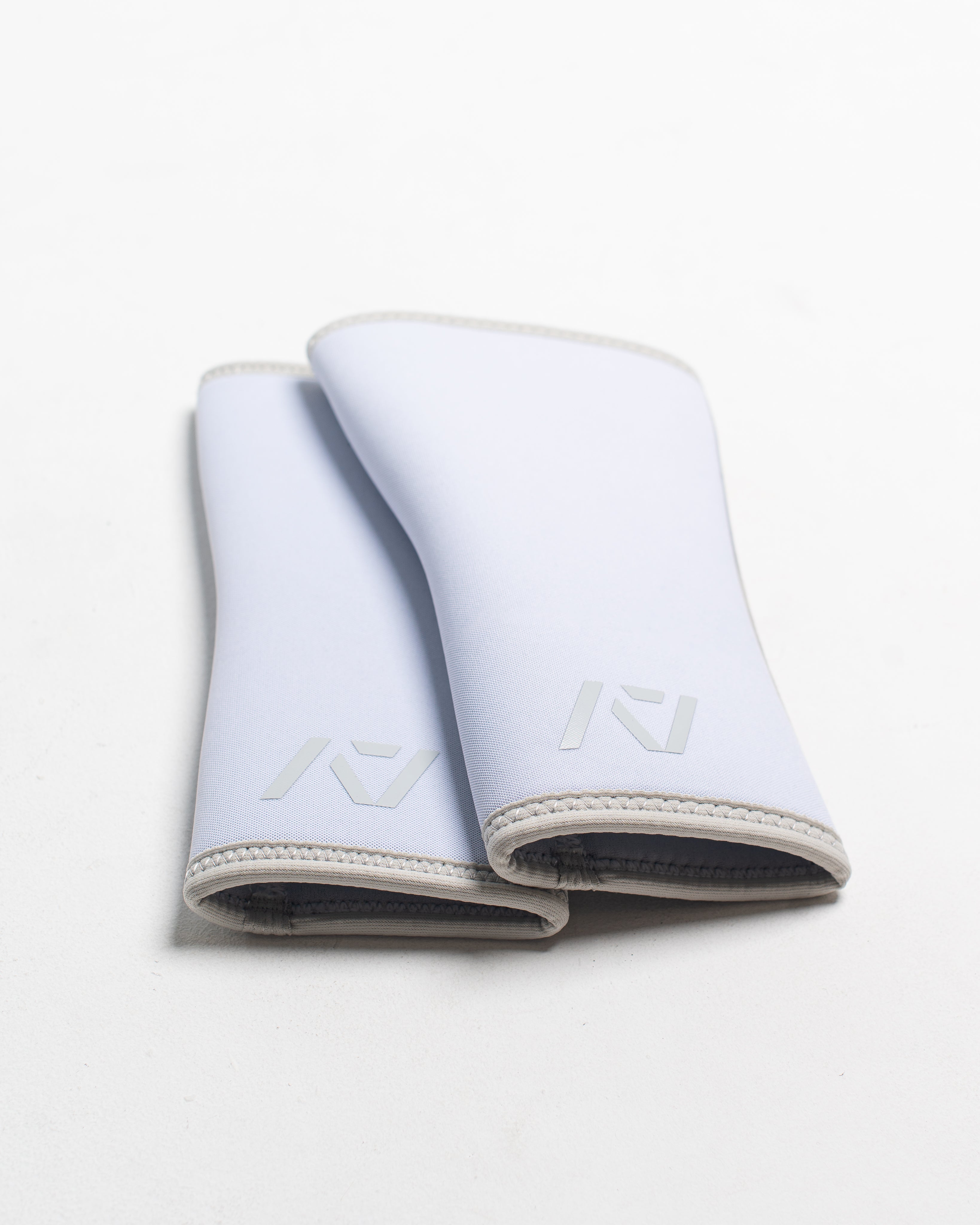 Flaylay of Knee Sleeves on white background together