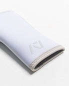 Close up of flatlay of stiff hourglass knee sleeve