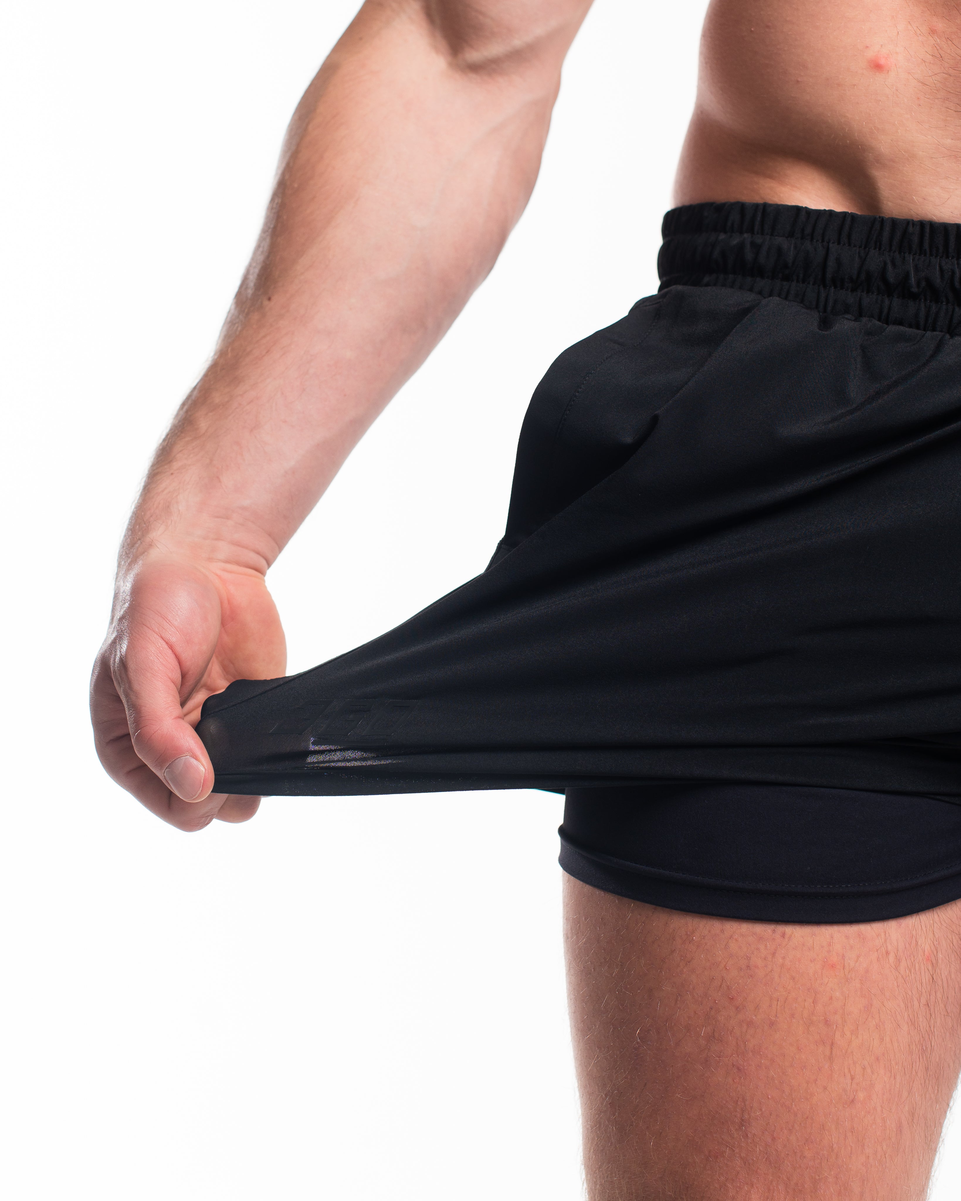 Demonstration of 360-degree stretch fabric on A7 Stealth 360Go shorts for full mobility in training.