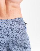 Key clips on both sides of Foggy Navy 360Go Shorts for secure and convenient storage during training.