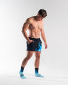 Full body image of athlete wearing A7 360Go KWD Shorts in Accelerant Blue, showing overall fit and performance-driven style.