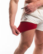 Showing the red under liner of the shorts with the stretch
