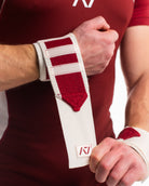 Close up of male model putting on ivory rose wrist wraps