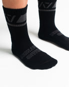 Close-up of the knit fabric on A7 Crew Socks in Shadow Stone, showing texture and stitching details.