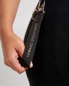 A7 Shadow Stone Keychain clipped to a gym bag, showing its compact and functional everyday use.