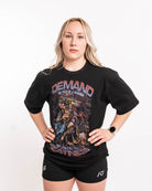 Front view of Aztec Warrior Over-Fit Unisex Shirt showcasing the detailed Aztec warrior design with eagle headdress and "Demand Greatness" spear.


