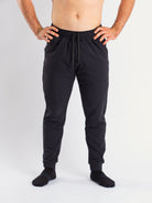 Front view of a7-us.mombra 360Go 1Z Joggers in Stealth, showcasing the sleek design and tapered leg fit.