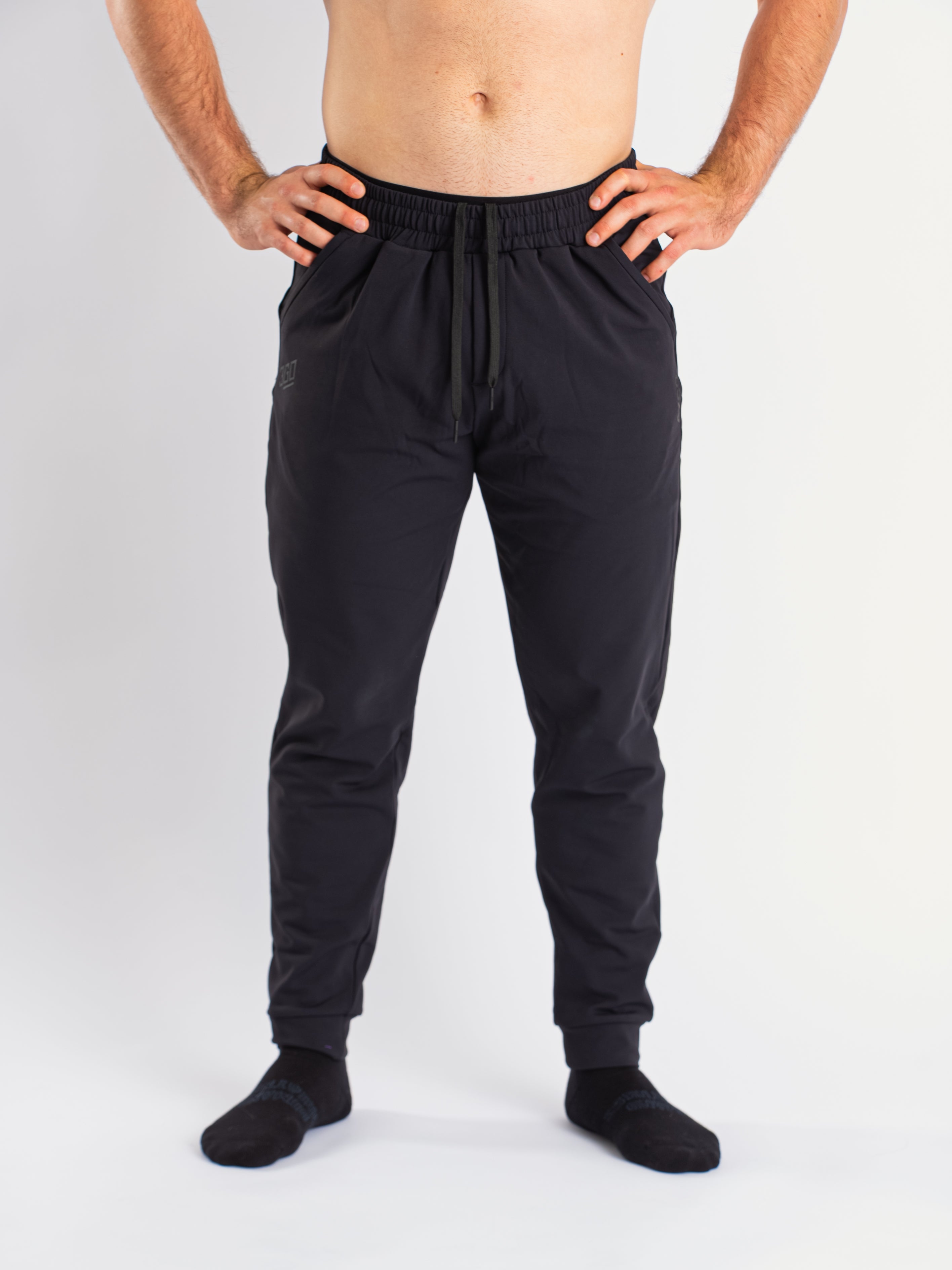 Front view of a7-us.mombra 360Go 1Z Joggers in Stealth, showcasing the sleek design and tapered leg fit.