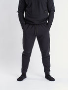 Front view of a7-us.mombra 360Go 1Z Joggers in Stealth, showcasing the sleek design and tapered leg fit.