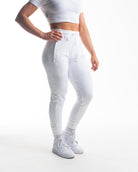 Front view of Polar Defy Joggers showing mid-rise waist, tapered legs, and zippered front pockets.
