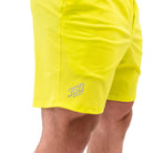 Matte silicone A7 logos on Electric Lemonade 360Go Shorts for sleek branding on a bright neon base.