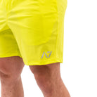 Matte silicone A7 logos on Electric Lemonade 360Go Shorts for sleek branding on a bright neon base.