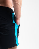 Close-up of ripstop nylon pocket and hidden mini wallet pocket on Azul 360Go Shorts for secure storage.