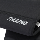 Detailed view of the reflective "Strongman" text on the black knee sleeves, emphasizing branding and design.