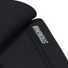 Detailed view of the reflective "Strongman" text on the black knee sleeves, emphasizing branding and design.