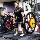 Athlete preforming deadlift with A7 Strongman Knee Sleeves – 9mm – Black/Reflective 